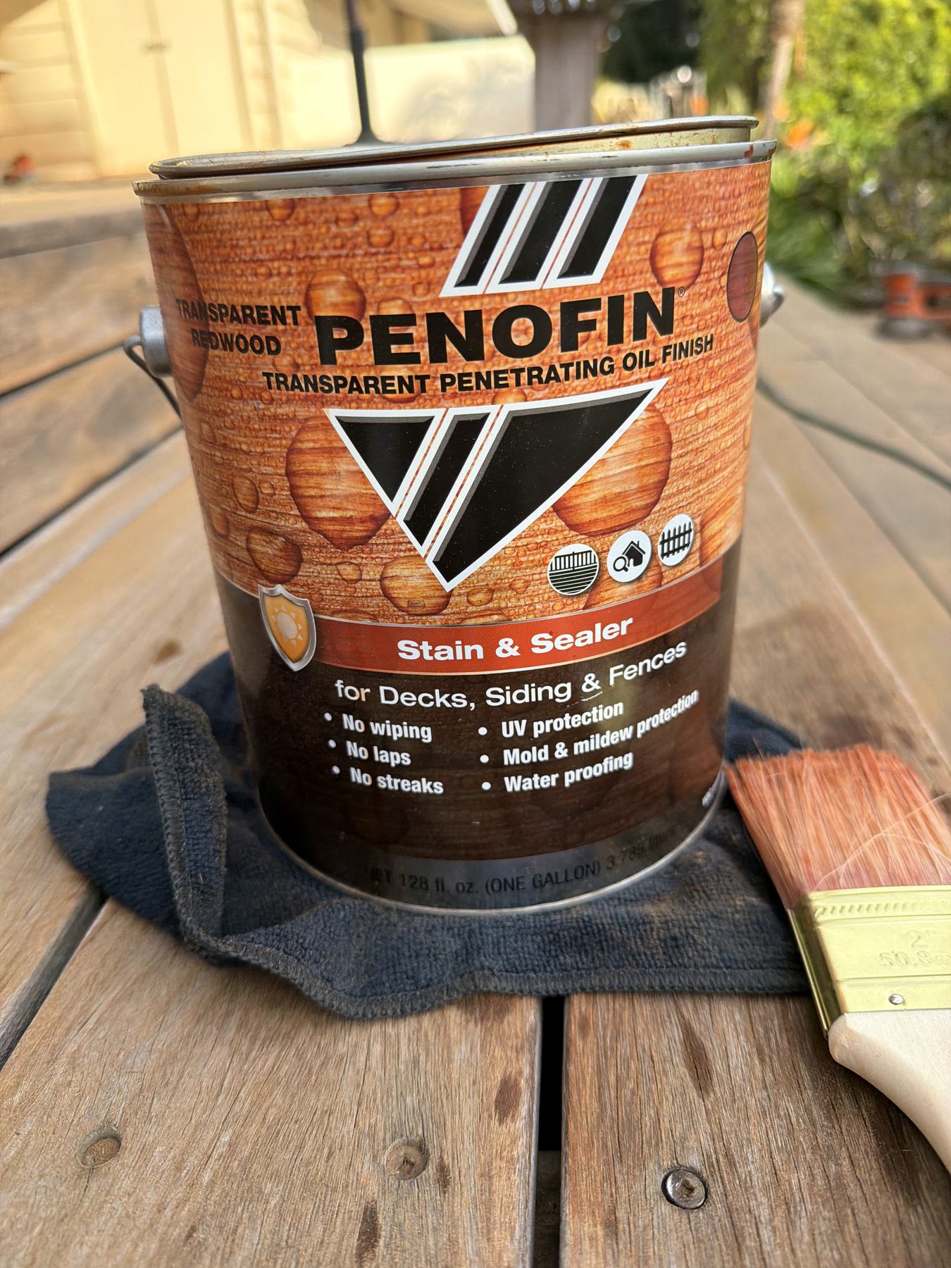 Penetrating wood finish being applied during a Santa Barbara deck restoration.