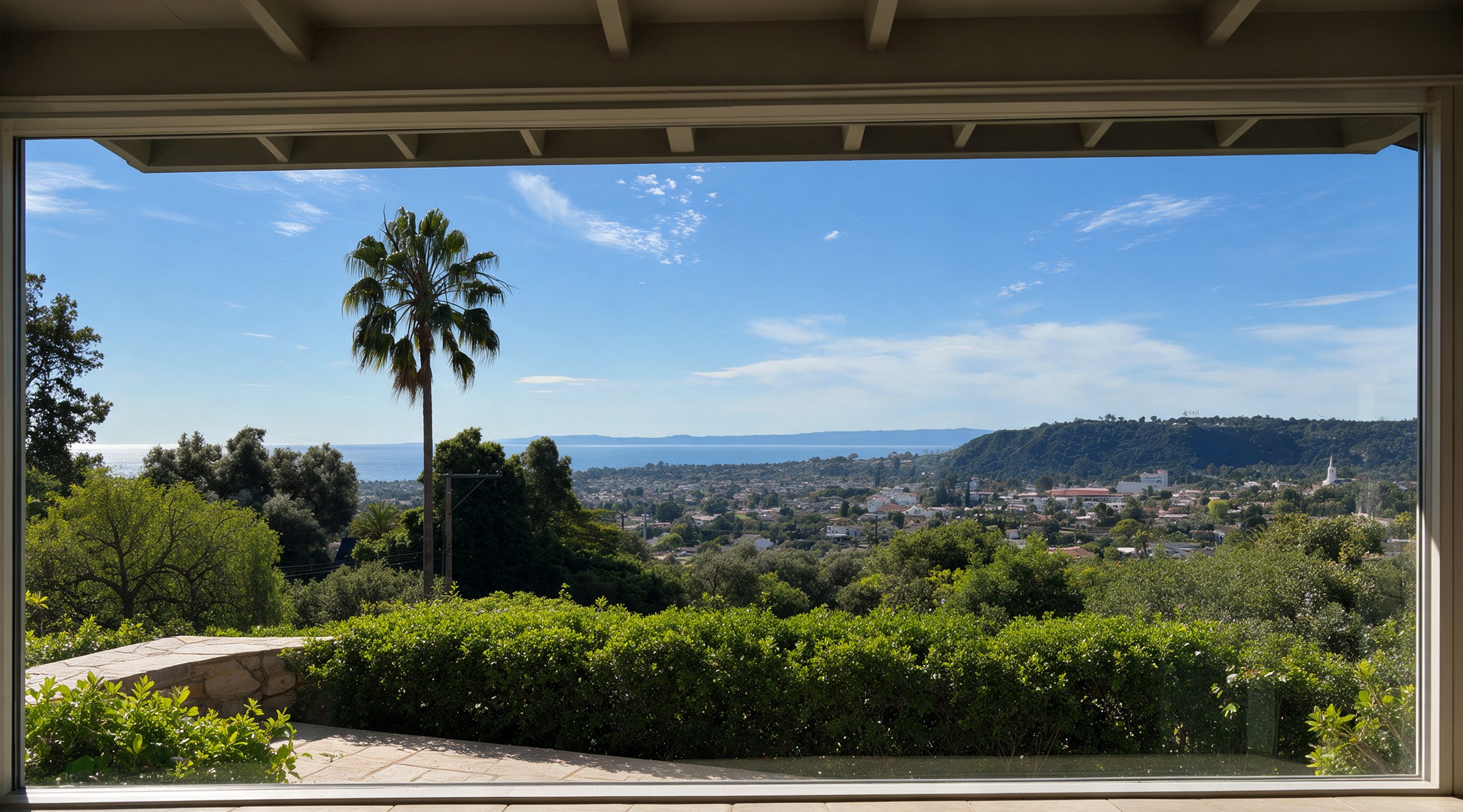 A spotlessly clean picture window looking out over the Santa Barbara hillside, a palm tree, the town's red-tile roofs, and the Pacific beyond.